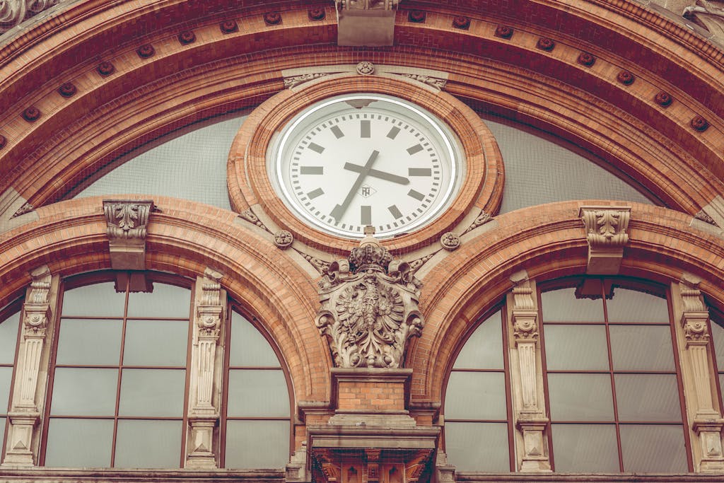 Brown Concrete Hall With Clock